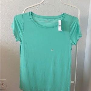 Loft T-shirt, it’s color is a soft light green.